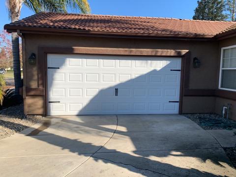 White CHI raised-panel garage door installed at a Turlock home