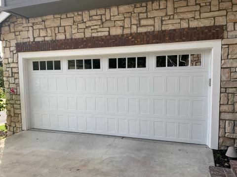White CHI shaker-panel garage door installed at a Danville home