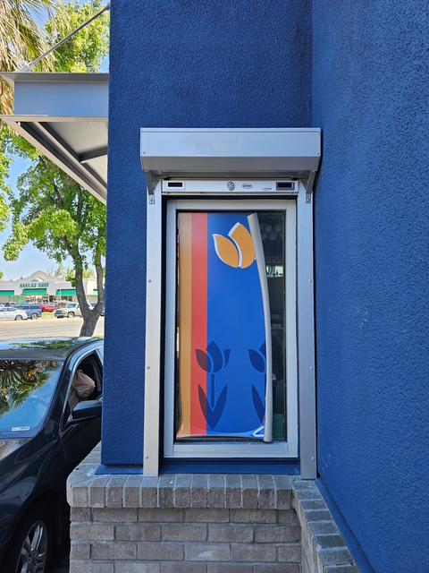 Clear anodized counter shutter installed at Dutch Bros in Stockton