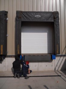 Barton technician servicing a loading dock seal